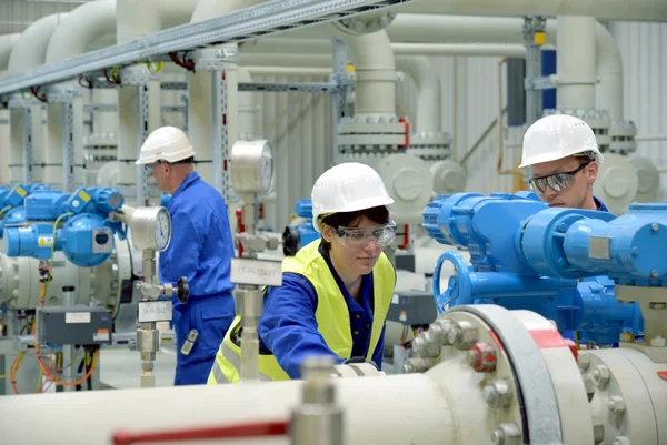 Employees of STORAG ETZEL in a factory hall